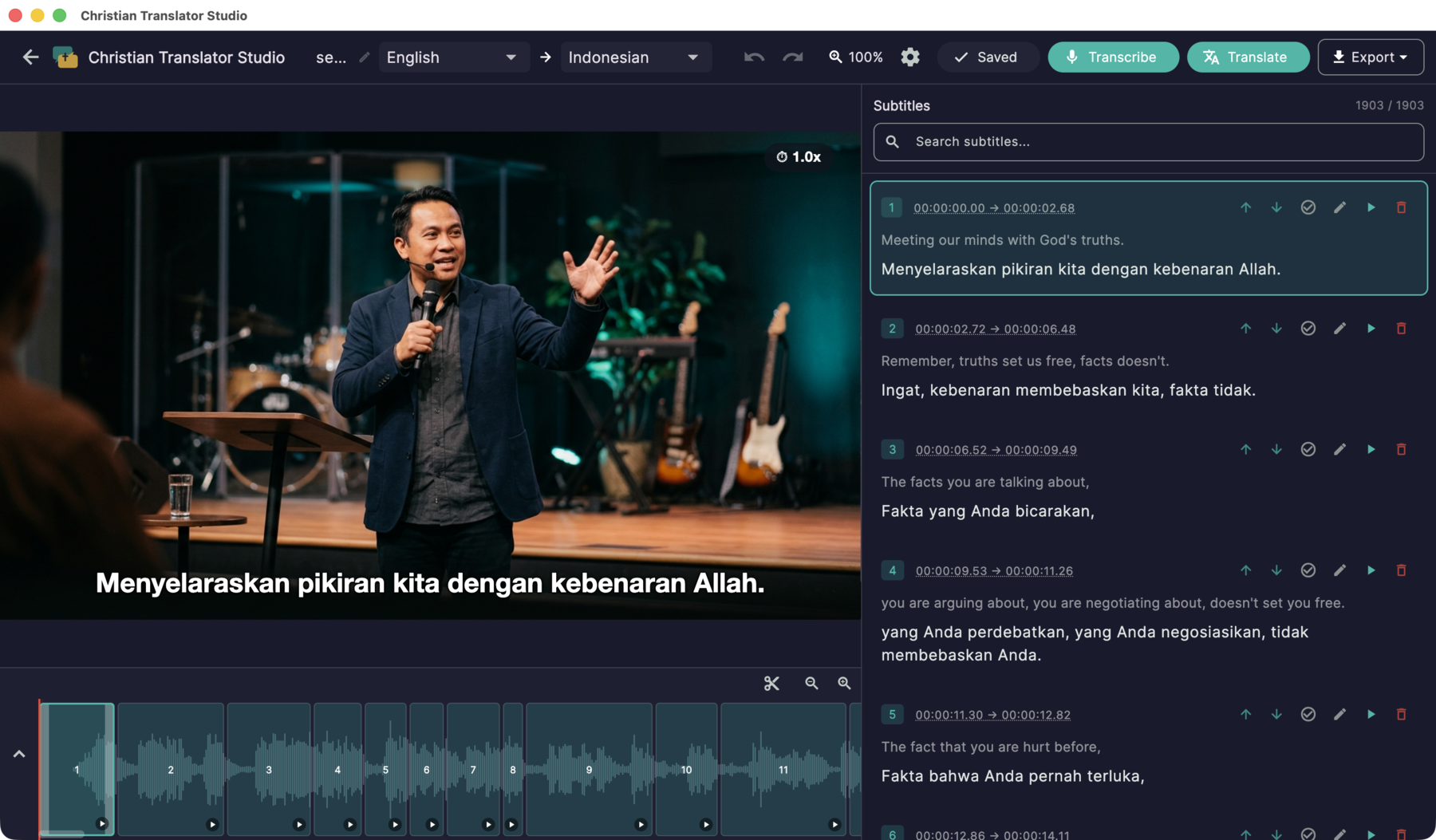 Christian Translator Studio: a real sermon project with 1,903 translated segments — video with a burned-in Indonesian subtitle, bilingual segment editor, and waveform timeline